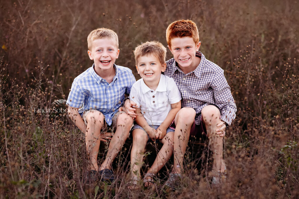 three little boys sitting in a field, Family photos at Hammonasset Beach