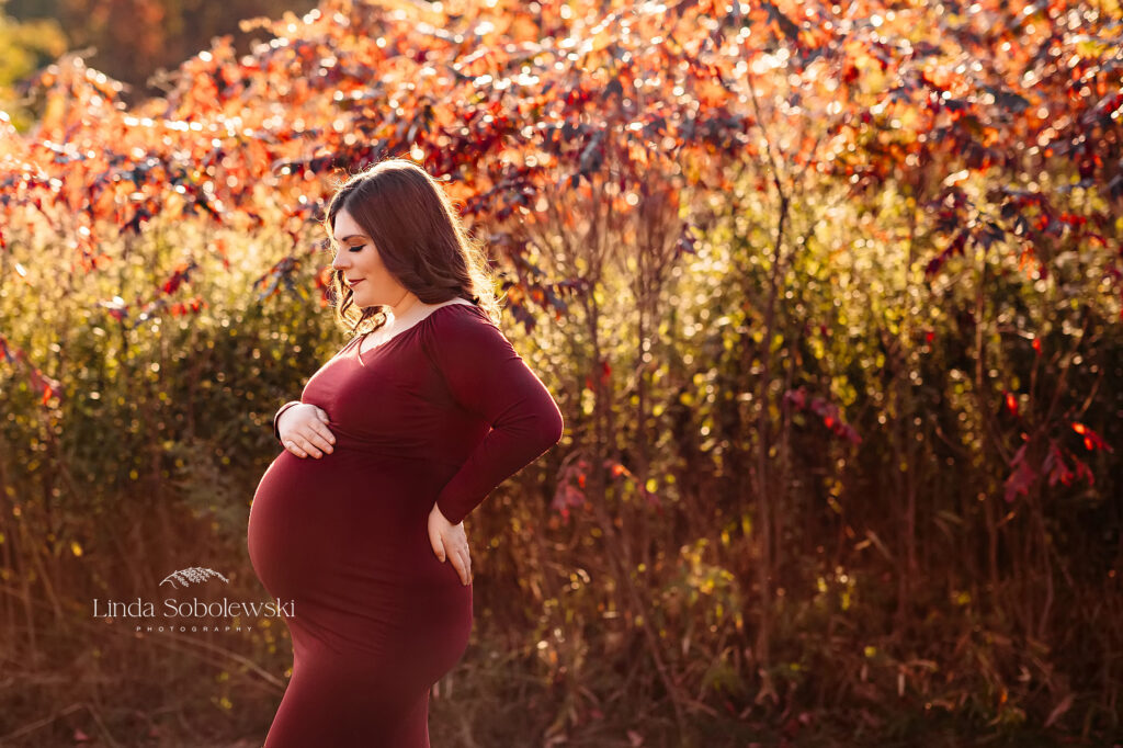 pregnant woman in red dress, Connecticut shoreline photographer