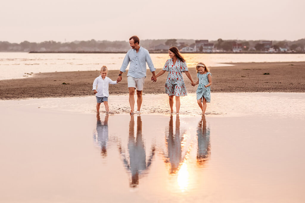 family of four walking on the beach, 2024 summer petite sessions with Old Saybrook CT photographer
