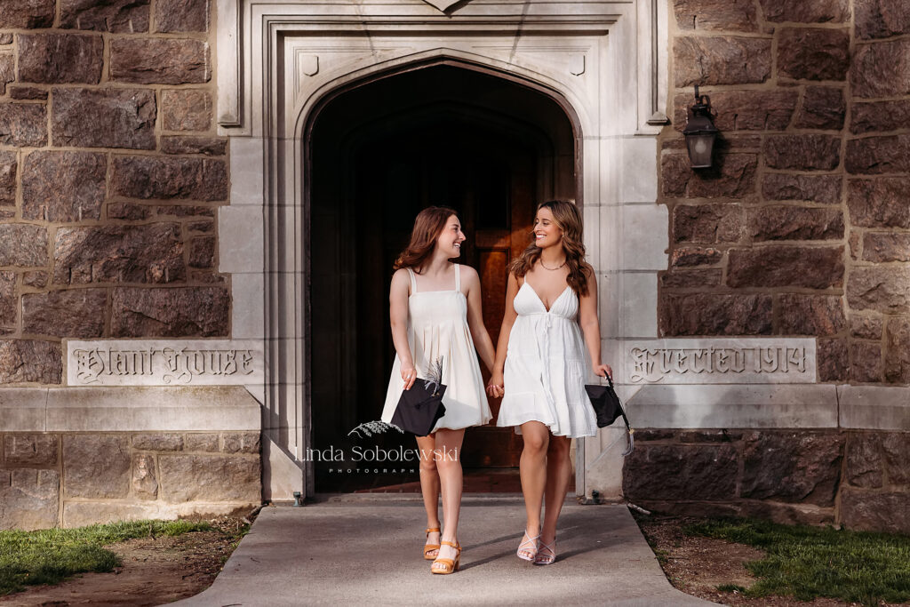 two girls in white dresses walking together, CT Graduation photography session