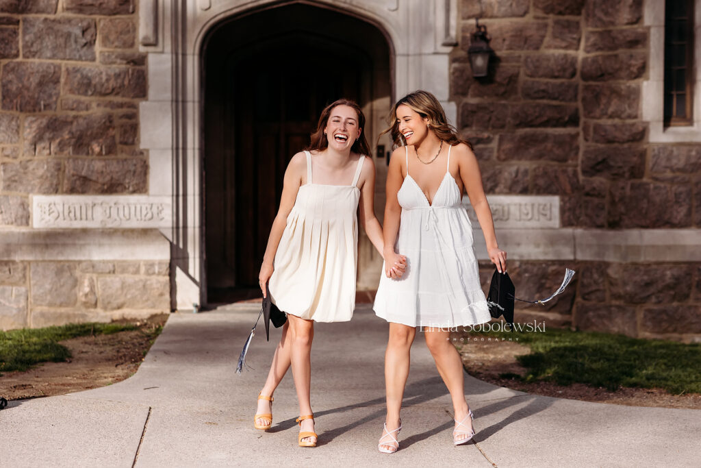 two girls in white dresses walking together, CT Graduation photography session