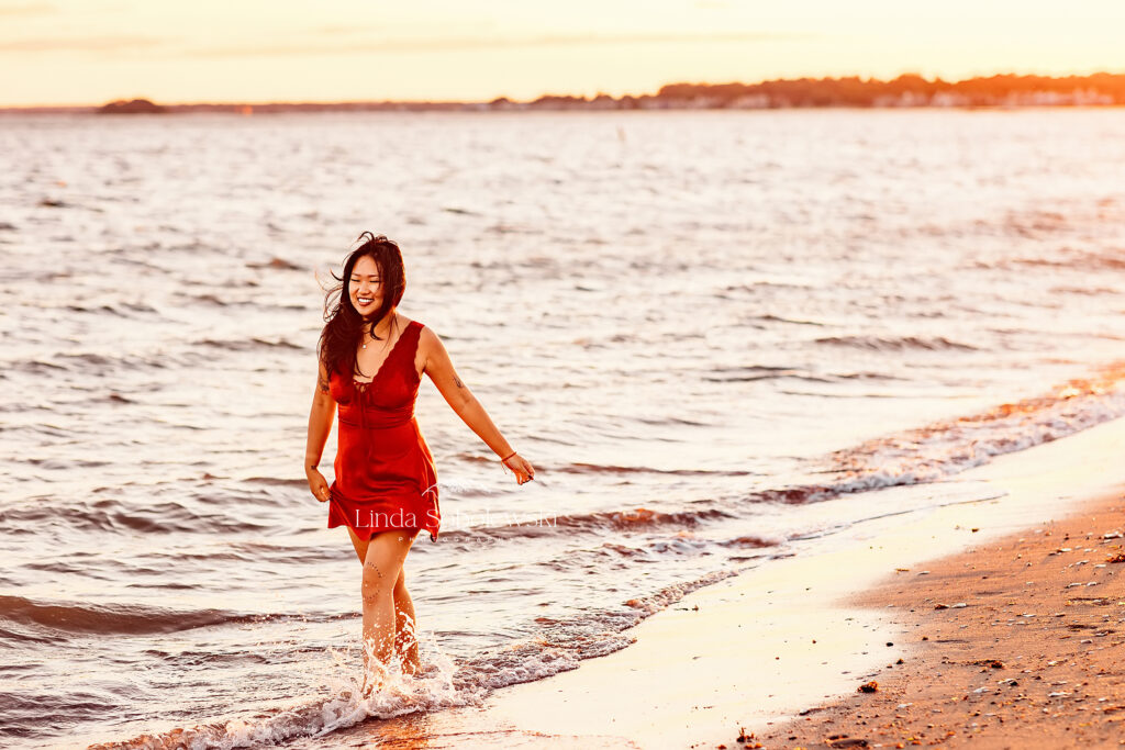 girl walking in the water at the beach, Connecticut graduation session at the beach, Old Saybrook Senior photographer