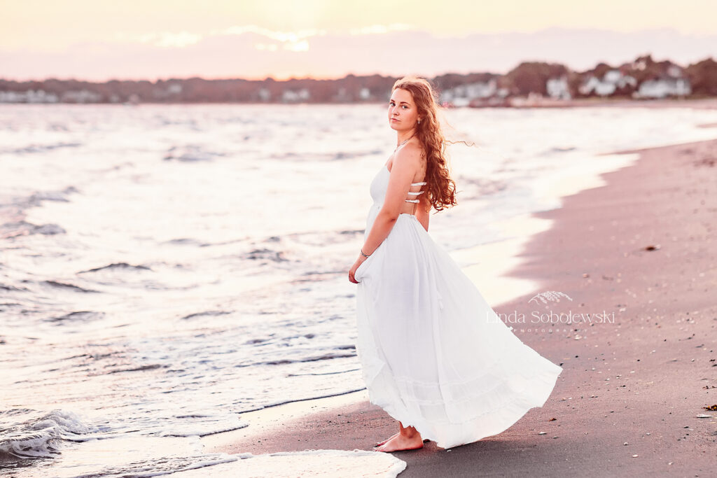 senior girl in white dress at the beach, Madison CT Senior Photographer