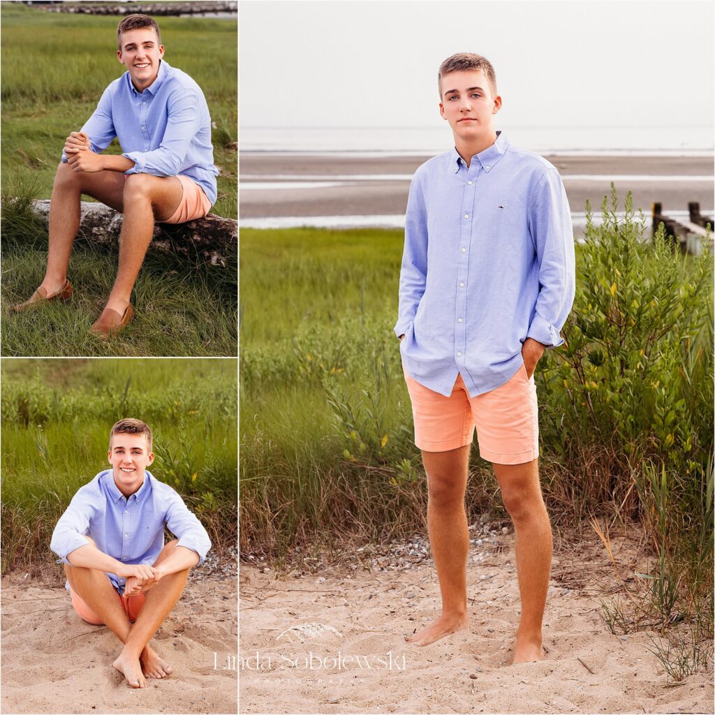 teenage boy in blue shirt and red shorts having casual senior photos taken at the beach, Madison CT senior phtoographer