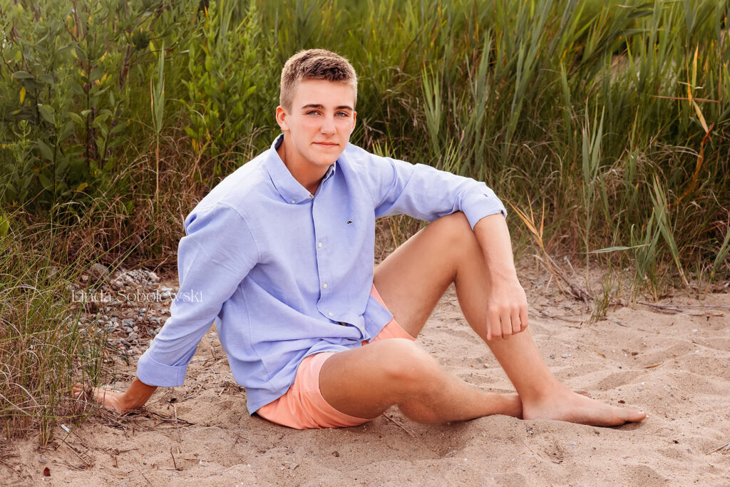 high school boy having casual senior photos taken at the beach, Madison CT senior phtoographer