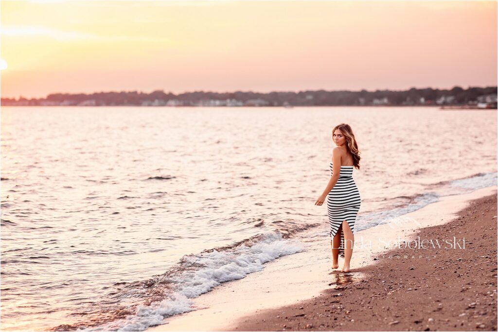 girl walking on the water at sunset, CT Senior girl photo session