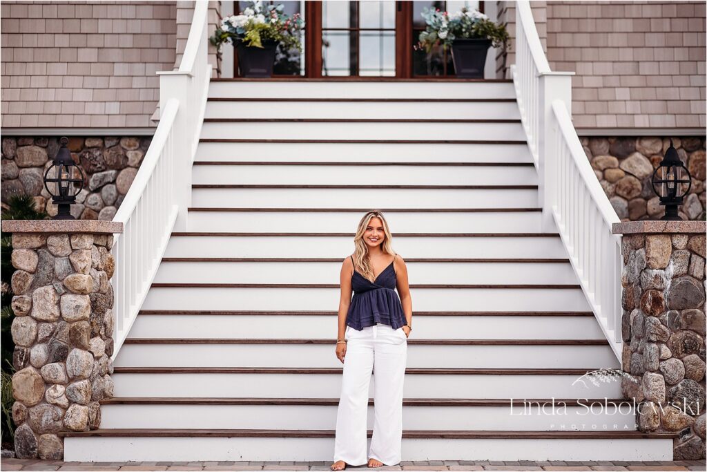 girl in blue top and white pants,Connecticut Senior Photographer