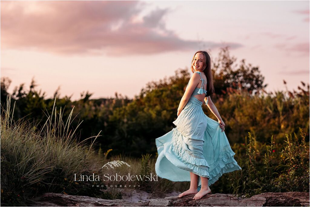 pretty girl in blue dress spinning around, Madison CT senior photographer