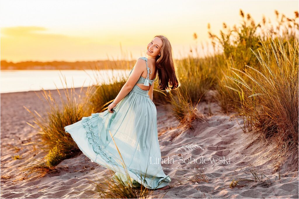 pretty girl in blue dress spinning around, Madison CT senior photographer