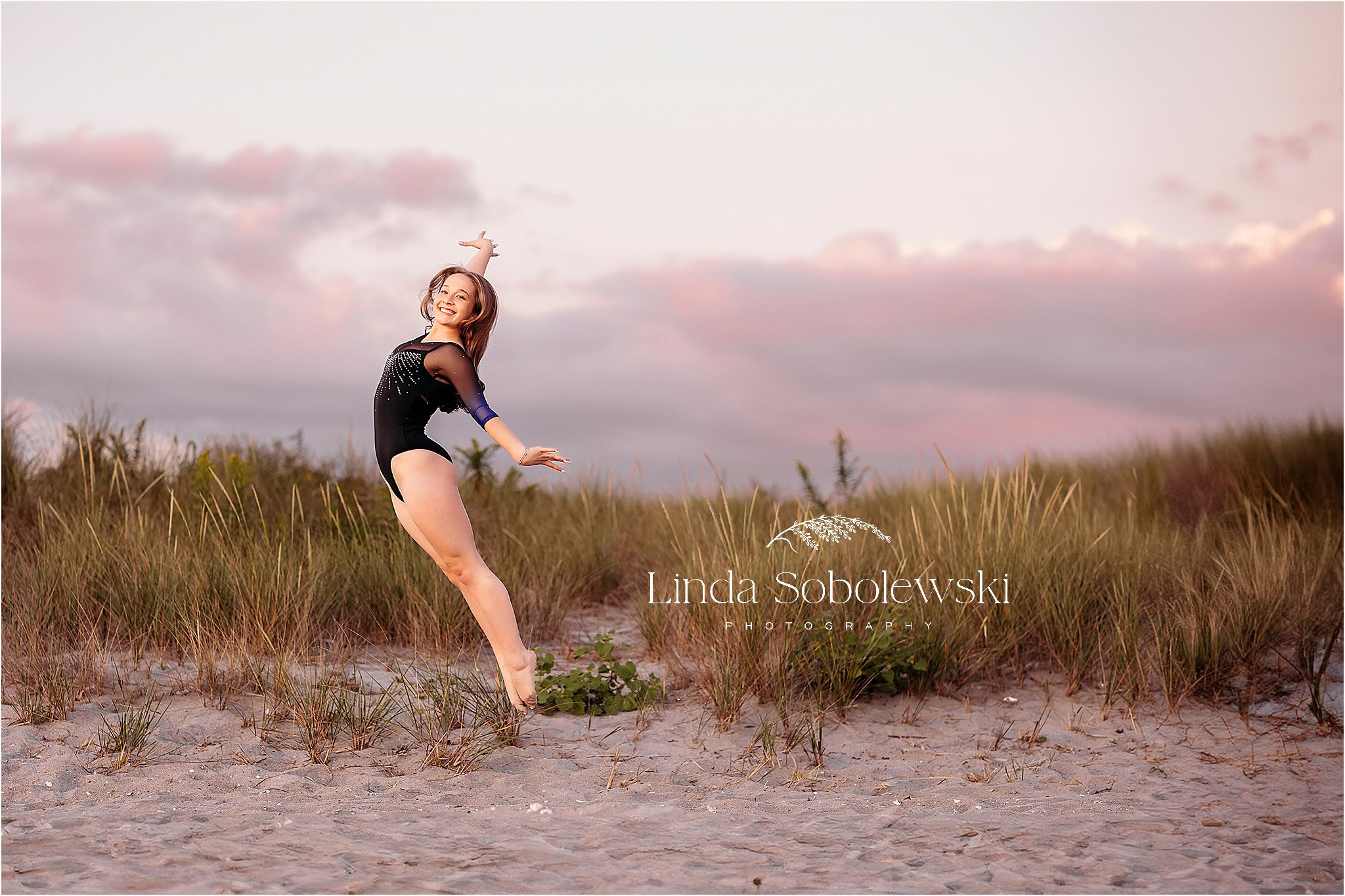 girl in gymnastics leotard jumping in the air, CT Senior photographer