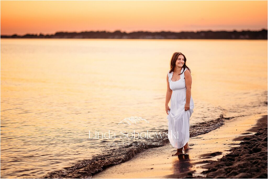 beautiful girl in long white dress at the beach during sunset, CT Senior Photos By The Water