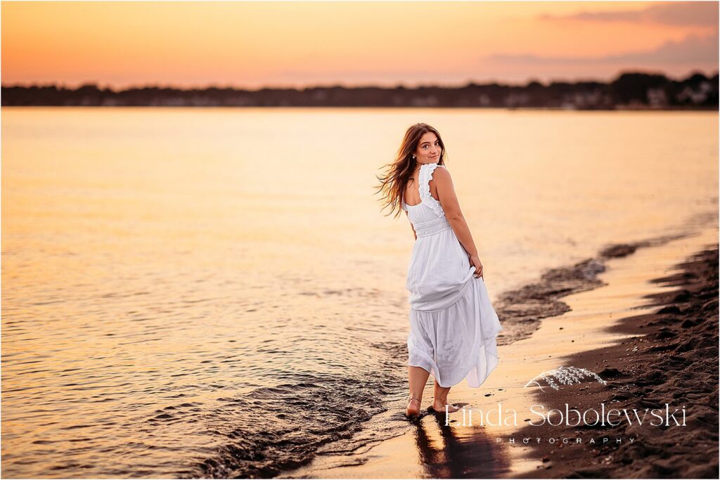 beautiful girl in long white dress at the beach during sunset, CT Senior Photos By The Water