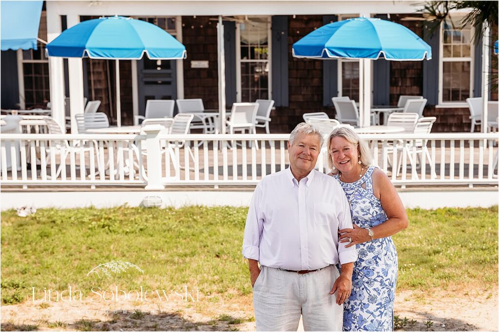 grandparents at their beach club,Multi-generational family photo shoot at the beach 