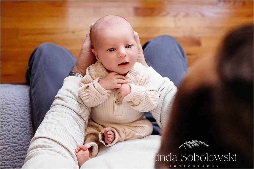 newborn baby in mother's lap, CT Newborn photo session