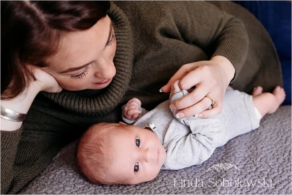 mother cradling her baby boy, Baby photographer in CT