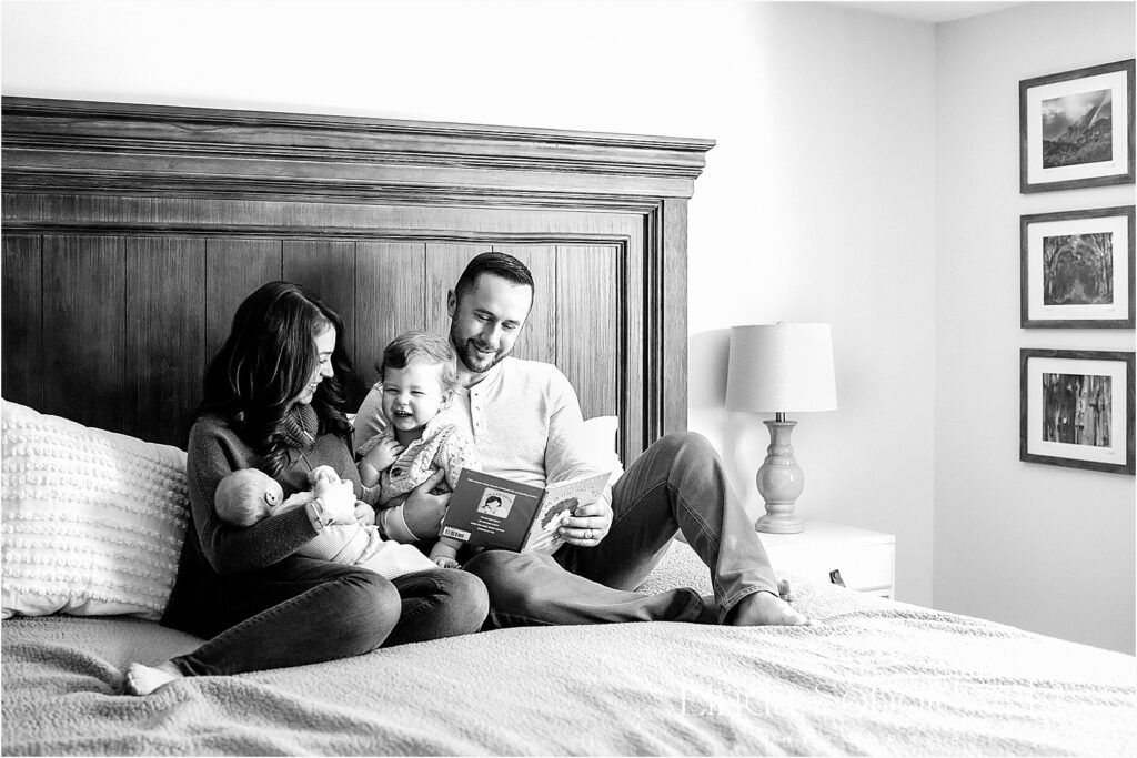 family of four in bed together. Newborn Photography session in Branford CT