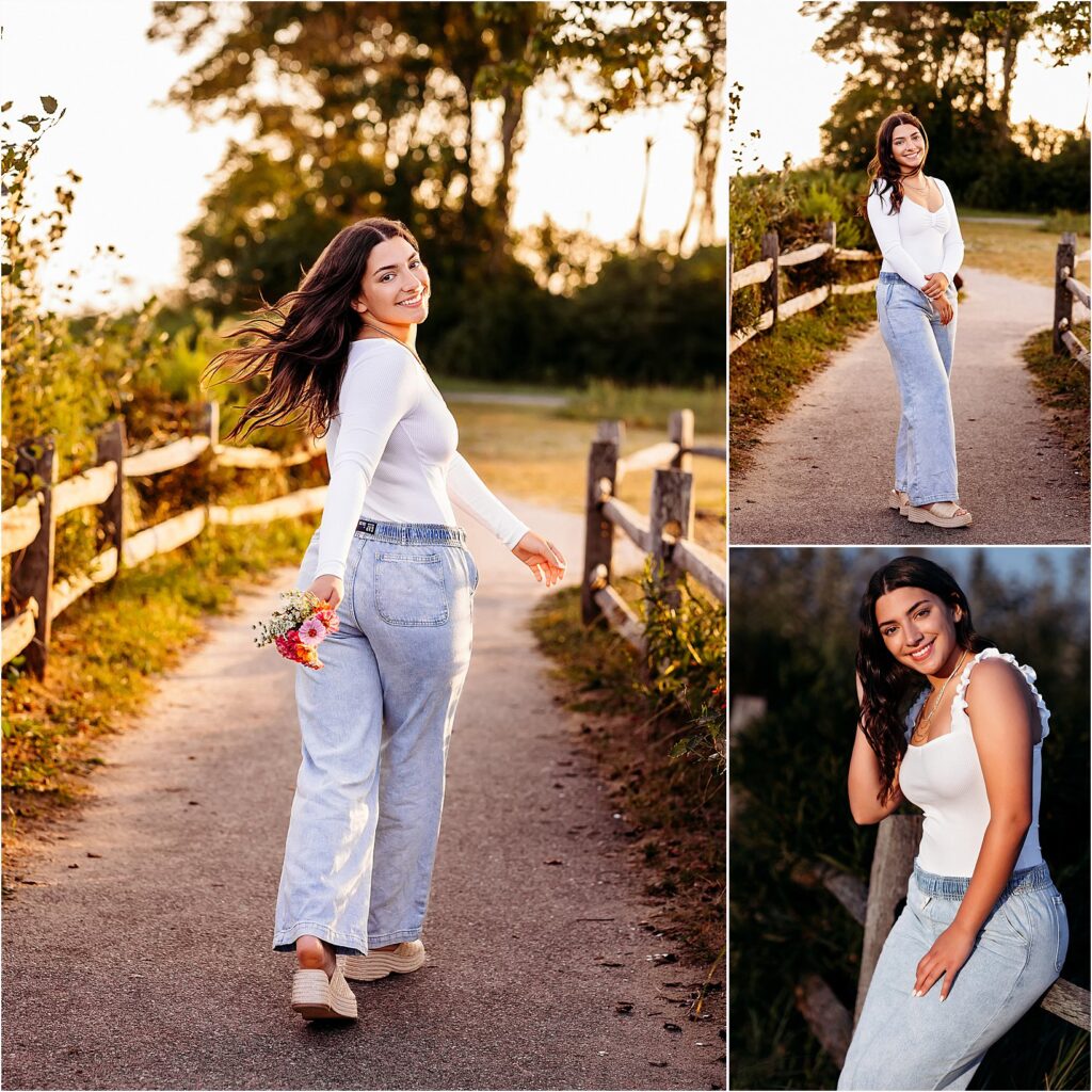 Madison, CT Senior walks along a charming pathway, exuding confidence and joy during her senior session. The warm golden light and rustic wooden fence create a picture-perfect moment.