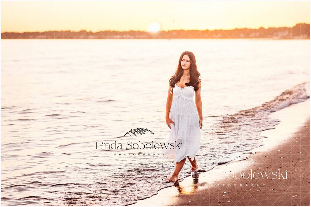 Essex CT senior photographer captures girl walking barefoot on the beach at golden hour — CT Shoreline Photographer