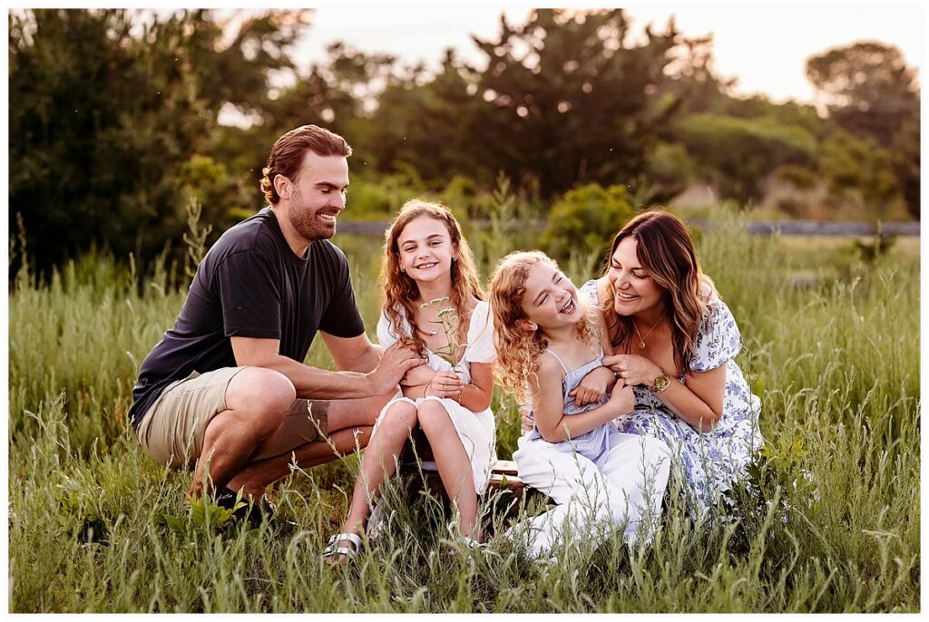 family playing and laughing together CT shoreline photographer