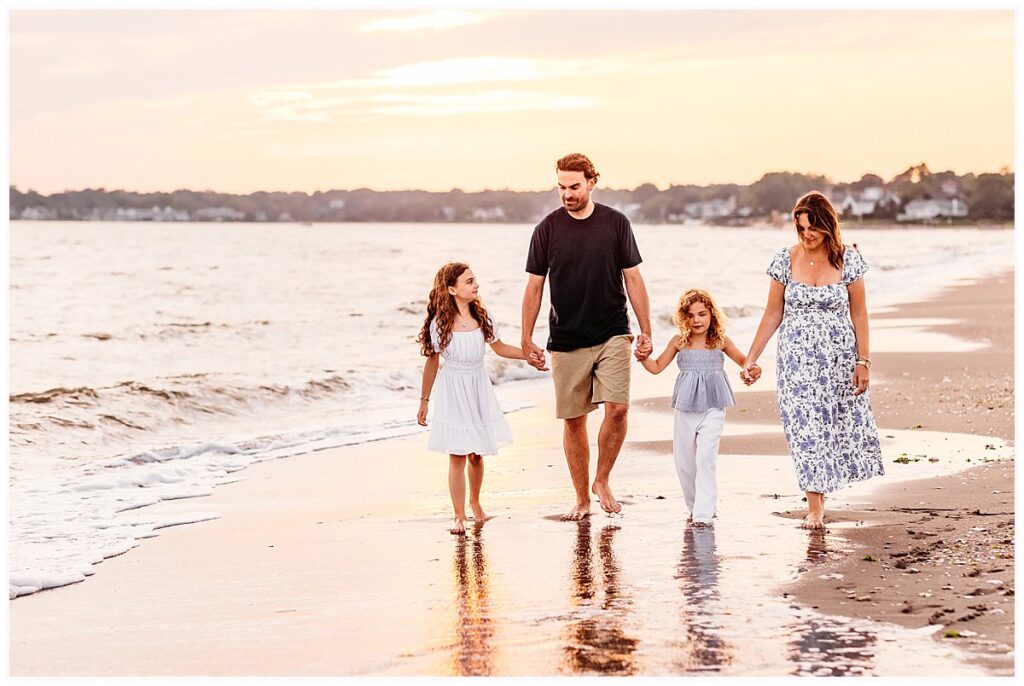 family of four walking on the beach,CT Family photographer