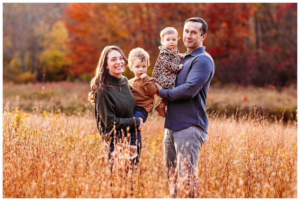 Fall family sessions at Bauer Park showing a family in a field of fall colors, CT family photographer