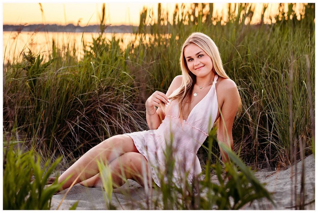 Hammonasset Beach senior photographer session with Lily laughing in golden hour light. CT shoreline photographer