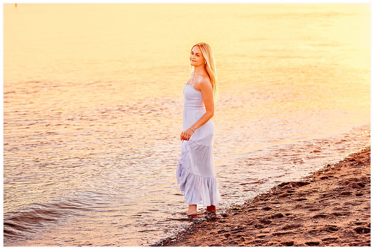 girl in blue dress walkiing on the beach at sunset, Hammonasset Beach Senior sesion