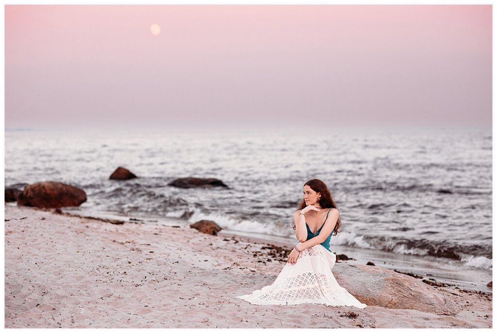 Senior Pictures in Connecticut beneath a beautiful pink and purple sky and rising moon at Harkness Memorial State Park.