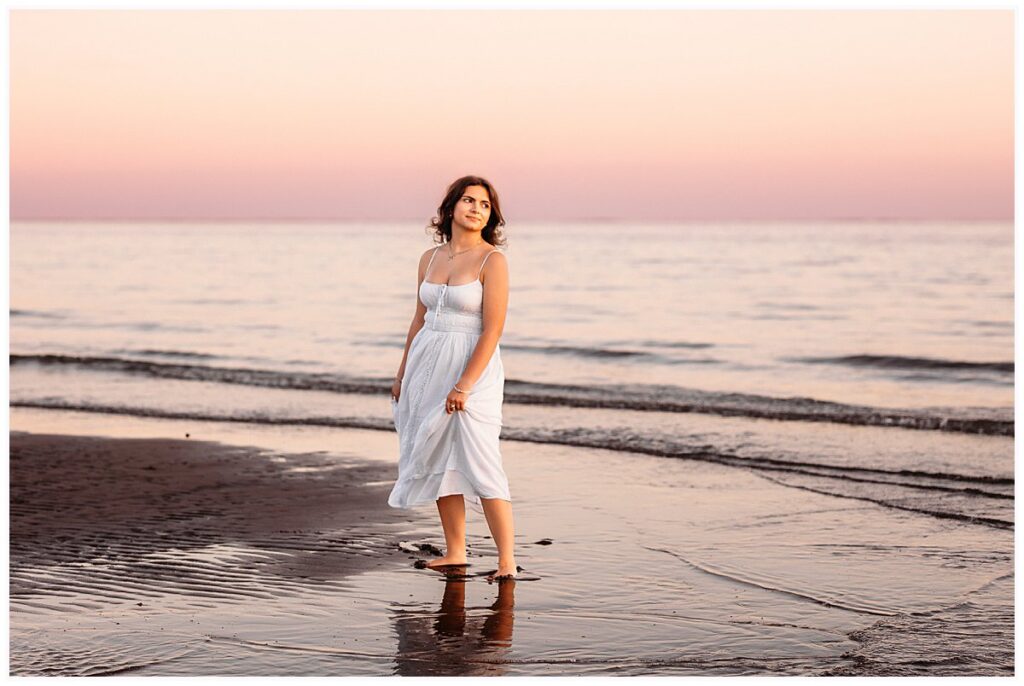 Connecticut beach senior pictures of Lily at sunset with soft pink and lavender skies, CT Best Senior Photographer
