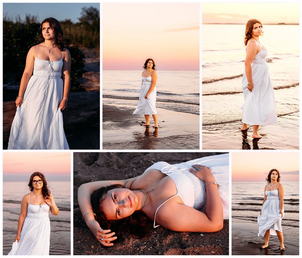 High School senior girl n a white sundress on wet sand reflecting the pastel sunset sky.