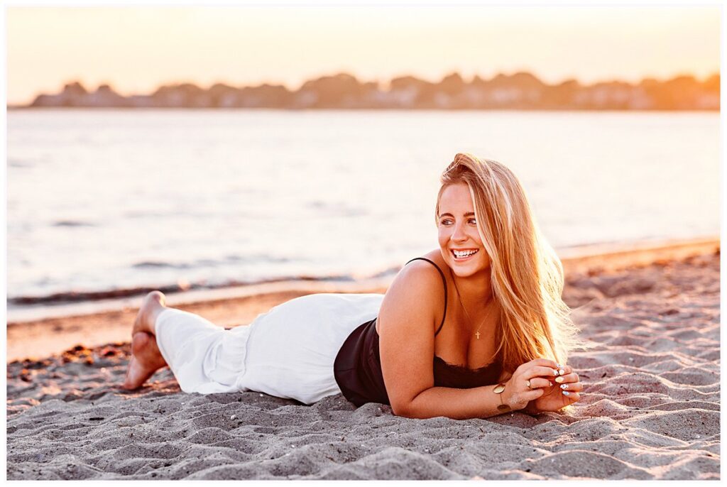 Old Saybrook Senior Session on a Boat featuring Elle posing on her family's boat and along the marina docks.